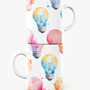 May include: Two white ceramic mugs stacked on top of each other. Each mug is decorated with a repeating pattern of watercolor-style light bulbs in various colors, including yellow, blue, and pink. The mugs have white handles.