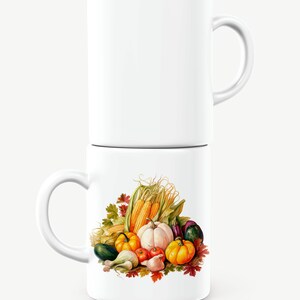 May include: A white ceramic mug with a handle, featuring a colourful illustration of a variety of autumn vegetables, including pumpkins, corn, and squash.