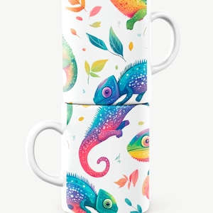 May include: Two white ceramic mugs with a colorful chameleon pattern. The chameleons are in shades of blue, green, pink, and yellow. The mugs are stacked on top of each other.