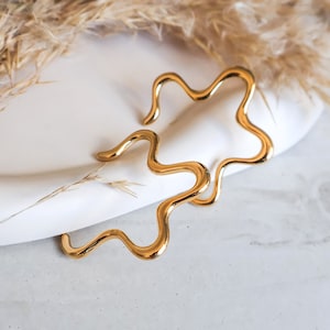 Pair of Gold Flower Shaped Earrings Minimalist Geometric Style