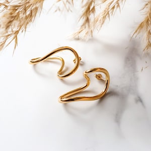 18k Gold Plated Geometric Bold Stud Earrings. Irregular Statement Waterproof Earrings. Tarnish Free Hollow Shaped Piece. Contemporary Design