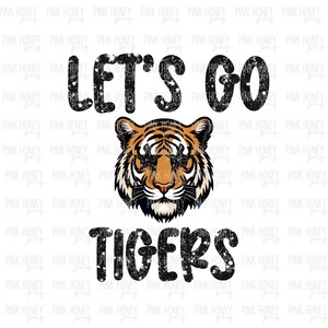 May include: Black and white distressed text that reads "Let's Go Tigers" with a tiger head graphic in the center. The tiger has orange and black stripes and a white background.