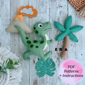 May include: Felt craft patterns for a dinosaur, palm tree, volcano, and monstera leaf. The patterns are available as a PDF download with instructions.  ERA is written on the wood background.