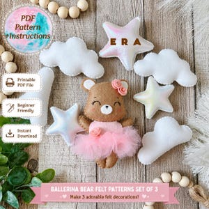 May include: A brown felt bear wearing a pink tulle tutu and a small pink flower on its head, surrounded by white felt clouds and iridescent stars. The image includes text reading PDF Pattern + Instructions, Printable PDF File, and ERA.
