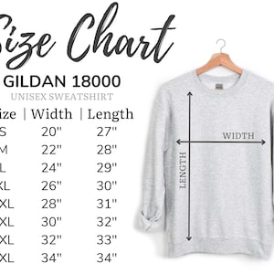 May include: A light grey Gildan 18000 unisex sweatshirt on a wooden hanger. A size chart displays measurements in inches for sizes S through 5XL, detailing width and length. Arrows on the sweatshirt indicate how to measure width and length.