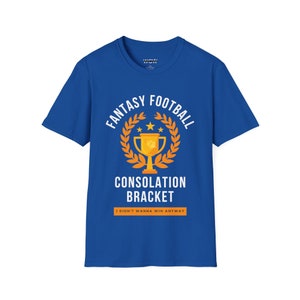 May include: A royal blue t-shirt with a white graphic design. The graphic features a gold trophy with a laurel wreath and the text "Fantasy Football Consolation Bracket I didn't wanna win anyway".
