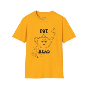 May include: A yellow t-shirt with a black and white illustration of a teapot with a face and the text "POT HEAD" and a tea bag.