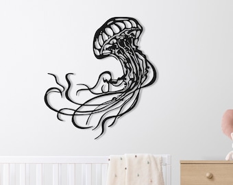 May include: Black metal wall art of a jellyfish with long flowing tentacles. The art is mounted on a white wall above a white crib and a wooden dresser.