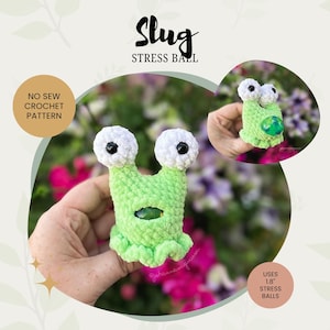 May include: A light green crocheted slug stress ball with white and black eyes. The image includes the text "Slug Stress Ball" and "No Sew Crochet Pattern". The slug uses 4.57 cm stress balls.