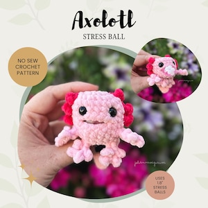 May include: A crocheted pink axolotl stress ball with red frills and black eyes. The image features the text "Axolotl Stress Ball" and "No Sew Crochet Pattern". The axolotl is shown in two views, one held and another close-up.