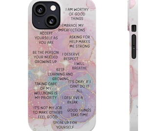 May include: A white phone case with a colorful, abstract design and inspirational text. The case features phrases like "I am worthy of good things" and "Accept yourself as you are." The case is designed to fit a smartphone.