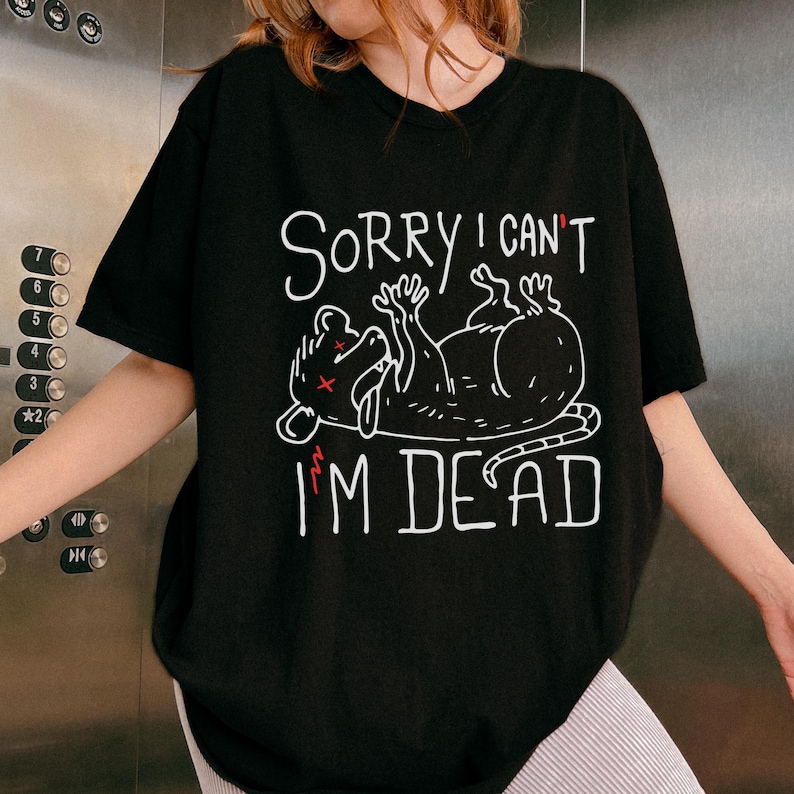 Text: "Sorry I Can't I'm Dead" Possum Sketch, Tongue Out with X Eyes Black Shirt, White Text and Outline, Funny Meme Tee, ADHD, Anxiety Opossum, Unhinged Tees, Weird Sarcastic, Shirts that go Hard, Oversized Grunge Tshirt Ironic Shirts, Unhinged
