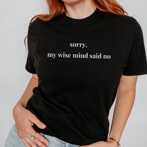 May include: Black t-shirt with white text that reads "sorry, my wise mind said no".