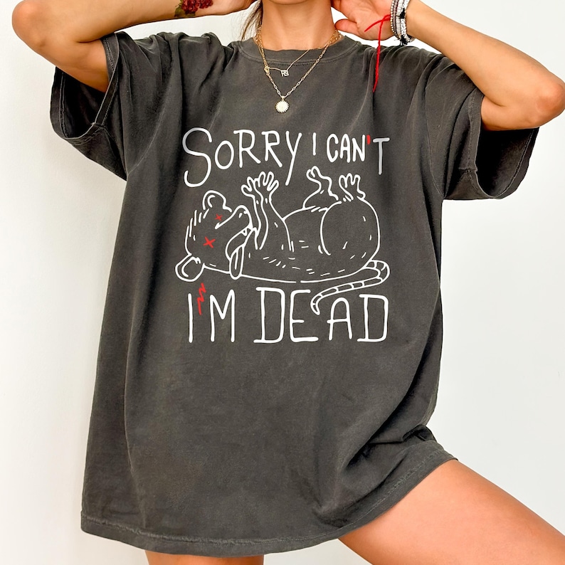 Text: "Sorry I Can't I'm Dead" Possum Sketch, Tongue Out with X Eyes Gray Shirt, White Text and Outline, Funny Meme Tee, Introverted, Anxiety Opossum, Unhinged Tees, Weird Sarcastic, Shirts that go Hard, Oversized Rave Tshirt Ironic Shirts Gift Ideas