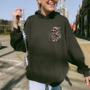Gildan 18500
Color: Black
Text: Everything's Fine 
Image: Flaming Skeleton with Pink Graffiti
Street Style, New York City, Elder Emo, Emo Phase, Art Hoe, Funny Mental Health, Overstimulated, Unhinged
