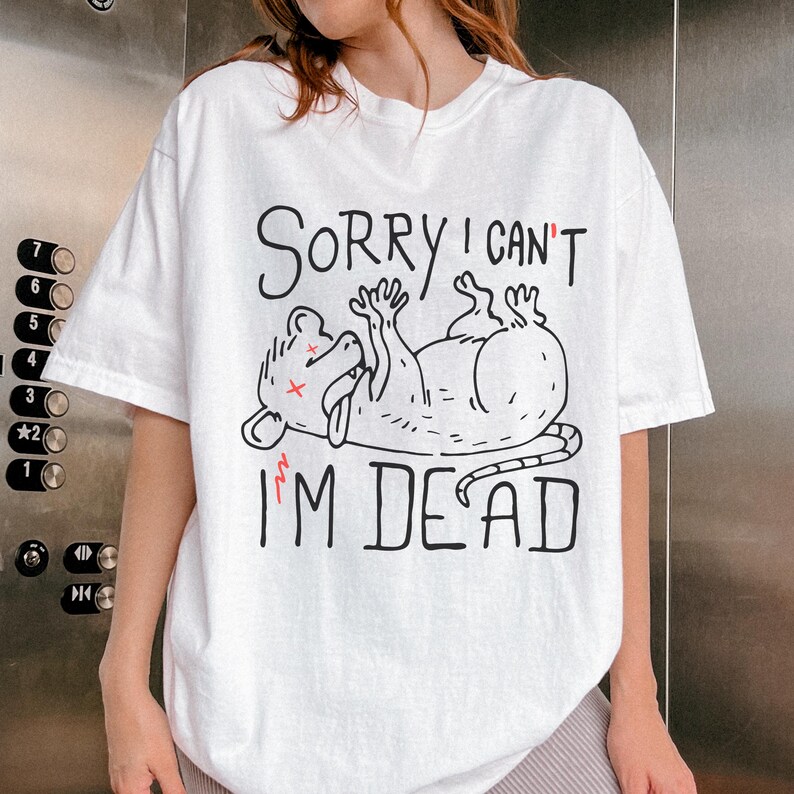 Text: "Sorry I Can't I'm Dead" Possum Sketch, Tongue Out with X Eyes White Shirt, Black Text and Outline, Funny Mental Health, Gift for Introverted Friend