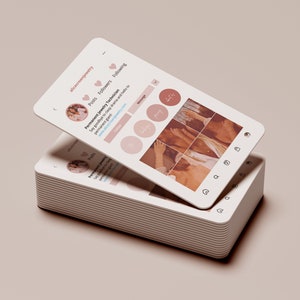 May include: A close-up of a mobile phone screen displaying a social media profile for a business called "alicecrownjewelry". The profile states "Permanent Jewelry Technician" and includes a website address. The profile picture shows a woman with long brown hair wearing a white shirt. The profile has a grid of nine photos, all of which are in a warm, earthy color palette.