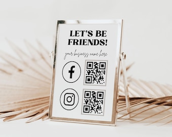 May include: A silver framed sign with the text "Let's Be Friends!" and the words "your business name here". The sign also includes Facebook and Instagram logos with QR codes next to them.