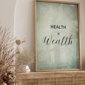 May include: A framed print with a green and blue watercolour background and the text "HEALTH is Wealth" in black.