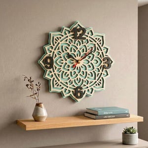May include: A decorative wall clock with a layered floral design. The clock features a light blue and natural wood colour scheme, with black numerals at the 12, 3, 6, and 9 o'clock positions. The clock hands are red.
