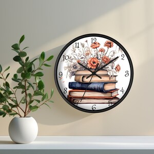 May include: A black and white clock with a stack of books and red flowers on the face. The clock has black hands and black numbers.