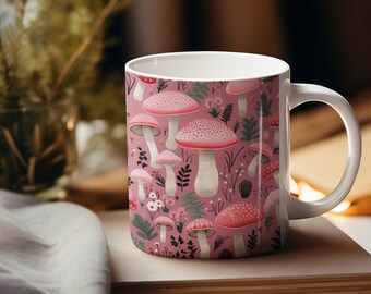 May include: White ceramic mug with a pink background and a pattern of pink and white mushrooms and green leaves.