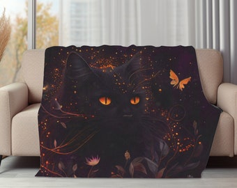 May include: A rectangular fleece blanket featuring a black cat with glowing orange eyes. The design includes floating orange embers, thin swirling vines, small flowers, and a single orange butterfly against a dark, deep purple background.