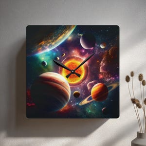 May include: Square wall clock featuring a vibrant depiction of the solar system. The clock face showcases planets, stars, and a bright sun, with black clock hands. The design includes shades of orange, blue, purple, and red.