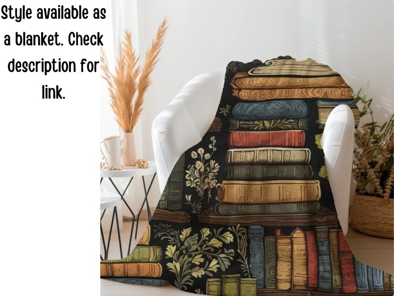 May include: A black and white throw blanket with a pattern of stacked books and floral accents. The books have detailed illustrations and are arranged in a bookshelf style.
