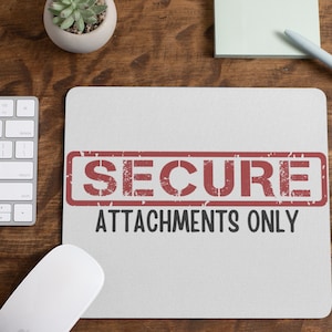 May include: A white mouse pad with a red and white "SECURE ATTACHMENTS ONLY" stamp.