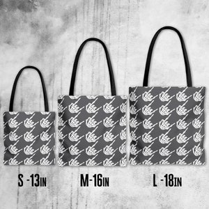 May include: Three tote bags with black handles and a repeating white skeleton hand design on a gray background. The bags are labeled S - 13IN, M - 16IN, and L - 18IN, indicating their sizes.