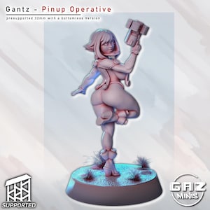 May include: A light pink figurine of a woman in a dynamic pose, holding a futuristic weapon. The figurine is labeled "Gantz - Pinup Operative" and is 32mm tall. The base is a light blue color with small tufts of grass.