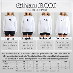 May include: White Gildan 18000 crewneck sweatshirt, shown in multiple sizes from M to 2XL, with size guide. The size chart provides measurements in inches for width, length, and sleeve length. The model is 5'8" and wears a size 10.