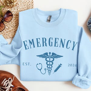 Custom Emergency Department Graphic Sweatshirt, Personalized ER Nurse Sweater, ED Crewneck Shirt, Gift for ER Tech, Er Room Doctor Staff Light Blue
