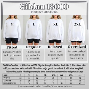 May include: Size chart for Gildan 18000 crewneck sweatshirts in sizes S to 5XL. The chart shows width, length, and sleeve length measurements in inches. The chart also includes descriptions of the fit for each size: fitted, regular, relaxed, and oversized.