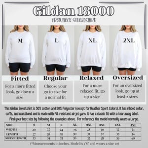 May include: Size chart for Gildan 18000 crewneck sweatshirts in sizes S to 5XL. The chart shows width, length, and sleeve length measurements in inches. The chart also includes descriptions of the fit for each size: fitted, regular, relaxed, and oversized.