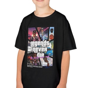 May include: Black t-shirt featuring a colorful graphic design with the text "legends never die". The design includes images of musicians and other graphics. The shirt is worn by a young person.