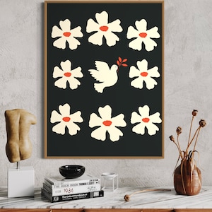 May include: A black and white print of a dove with an olive branch in its beak surrounded by white flowers with red centers on a black background.