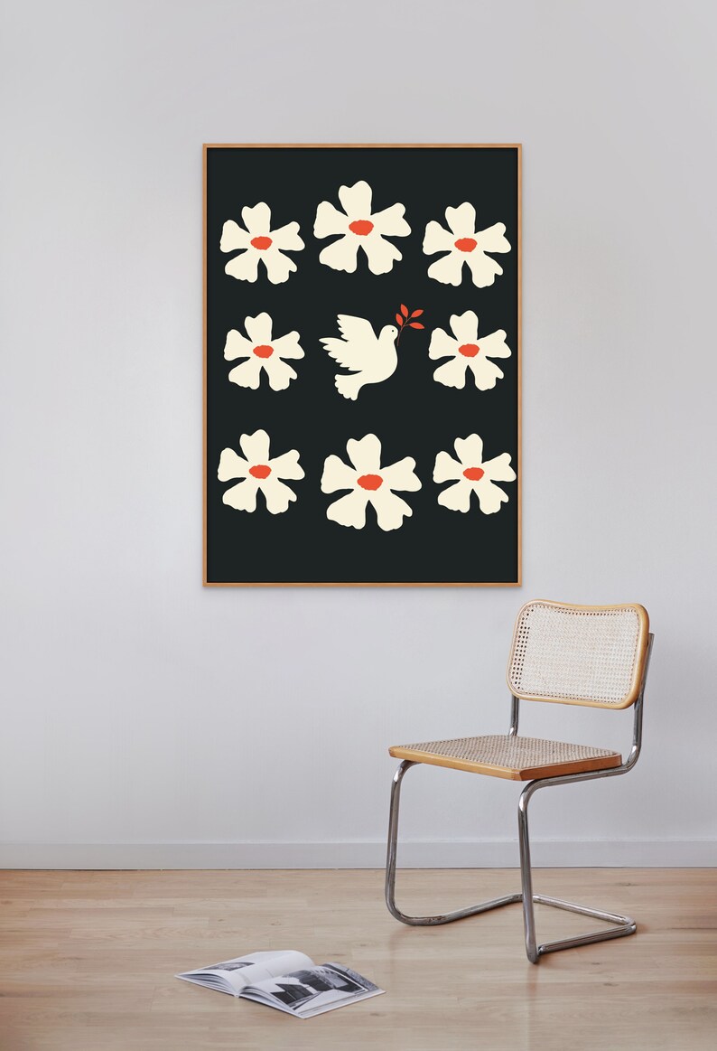 May include: A framed print with a black background and white flowers with red centers. A white dove with an olive branch in its beak flies in the center of the print.