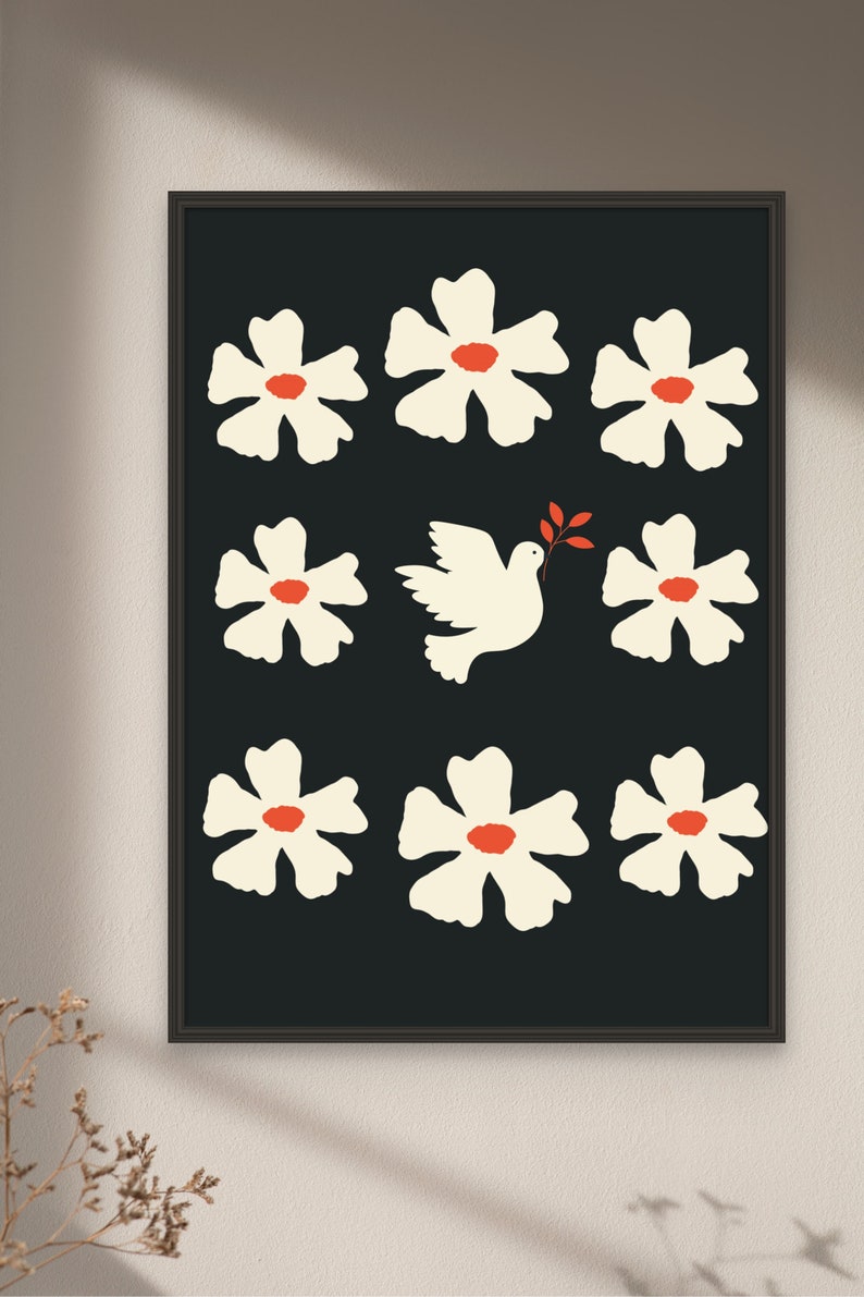May include: A black and white print with a white dove carrying an olive branch in its beak, surrounded by white flowers with red centers on a black background.