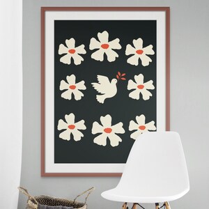 May include: A framed print with a black background and white stylized flowers with red centers. A white dove with a red branch in its beak is in the center of the print.