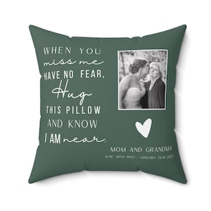 May include: Square green pillow with a photo of two women, a white heart, and text that reads "When you miss me have no fear, Hug this pillow and know I am near." The text also includes "Mom and Grandma."