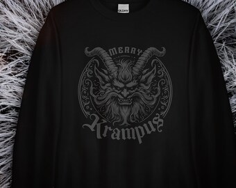 May include: Black long-sleeve sweatshirt with a gray print of a horned creature with the text "Merry Krampus".