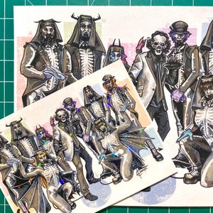 May include: Illustration of figures in skeleton suits and formal wear, some with bat wings and hats. The artwork is on a white background with a green cutting mat. The style is gothic.