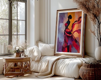 May include: A framed abstract painting of a woman in a flowing red dress with a long scarf. The artwork features a color palette of red, purple, and orange hues. The painting is displayed on a white sofa with pillows, a beige throw, and a wooden side table.