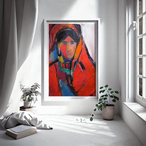 May include: A framed abstract painting featuring a portrait of a person. The artwork uses bold brushstrokes and vibrant colors, with a focus on red, orange, and blue hues. The subject is depicted with a dark head covering.