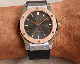 Montre automatique pour homme Hublot bicolore en or rose avec cadran gris foncé et bracelet en caoutchouc noir