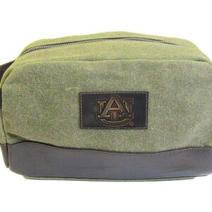 Auburn Tigers Men&#39;s Toiletry Dopp Bag. Olive Drab Waxed Canvas With Brown Burnished Full Grain Leather Trim. Debossed Patch Logo.