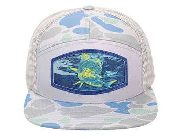 May include: A light gray trucker hat with a camouflage pattern in blue, white, and green. The front panel features a rectangular patch with a blue border, showcasing a detailed illustration of a fish underwater.