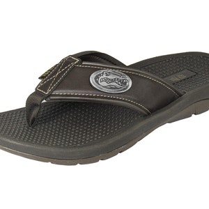 May include: Brown leather flip-flop sandals with a brown alligator logo on the strap.